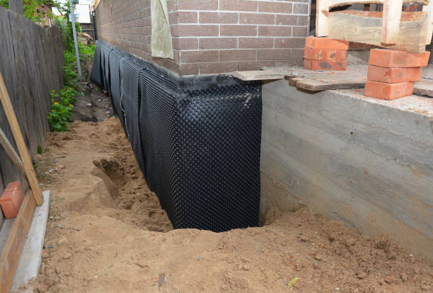 SJ Waterproofing Pros technician performing targeted Emergency Waterproofing assessment in Arcade, NY